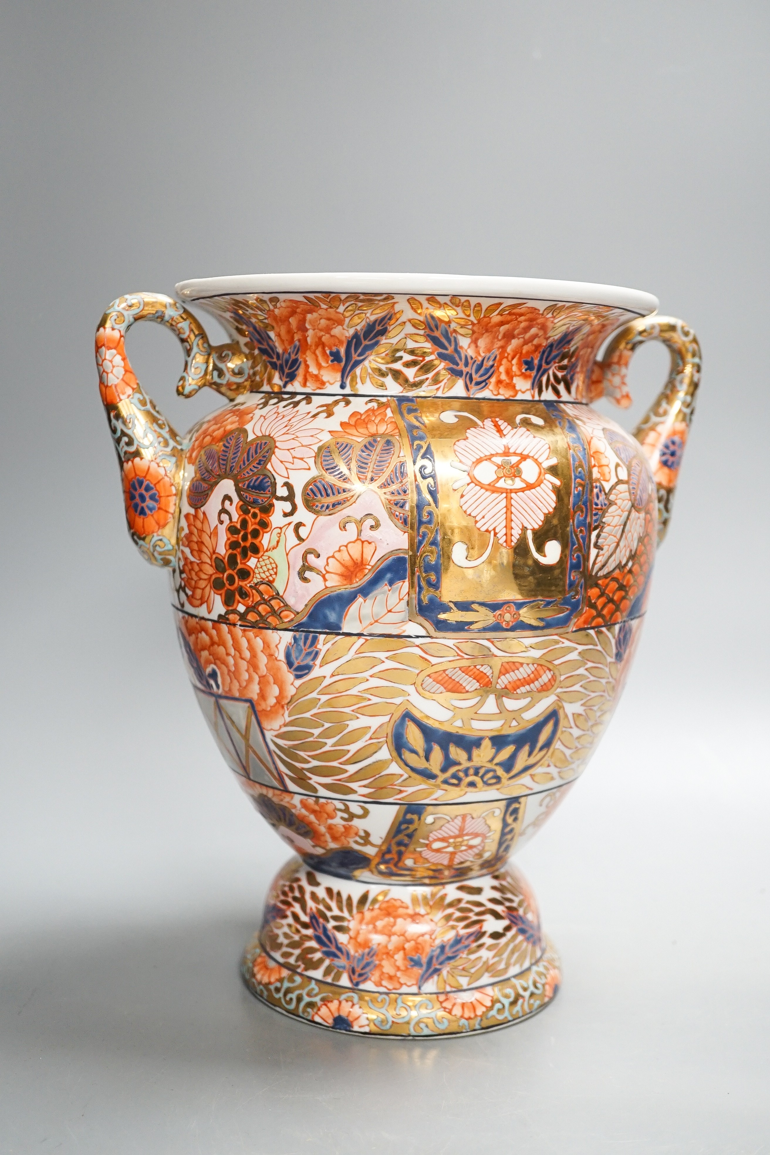 A twin handled Imari palette vase, a Japanese eggshell porcelain footed bowl, together with an 18th century Chinese porcelain bowl and saucer (with damage) 25cm (4)